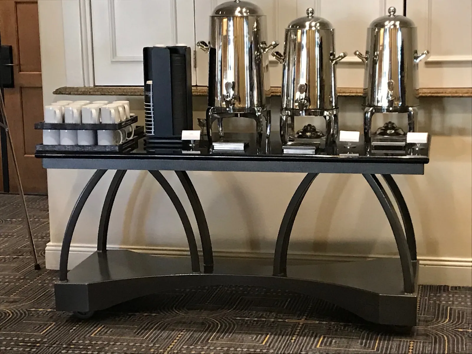 Arched coffee break table set for beverage service in a hotel meeting space Arched coffee break table set for beverage service in a hotel meeting space