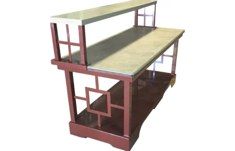 Coffee break table Coffee break table with fretwork base, granite top and two-tier glass riser